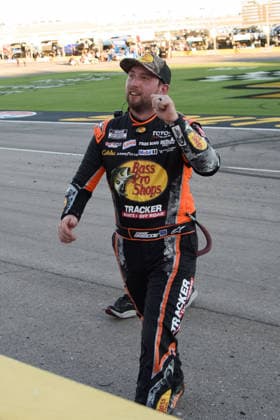 LAS VEGAS, NV - OCTOBER 04: Chase Briscoe ( 19 Joe Gibbs Racing Bass Pro Shops Toyota) walks up the track to receive the Sunoco checkered flag to celebrate winning the race during the NASCAR, Motorsport, USA Cup Series Playoffs South Point 400 on October 04, 2026, at Las Vegas Motor Speedway in Las Vegas, NV. (Photo by Chris Williams LVMS Icon Sportswire) AUTO: OCT 04 NASCAR Cup Series Playoffs South Point 400 EDITORIAL USE ONLY Icon0072610041260