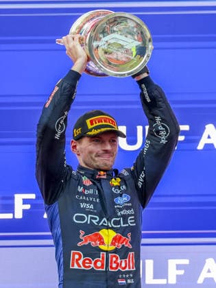 KUALA LUMPUR, MALAYSIA - OCTOBER 04: Max Verstappen of the Netherlands and Oracle Red Bull Racing celebrates on the podium with trophy after winning after the race of the FIA Formula 1 Grand Prix of Bahrain in Malaysia at the Sepang Circuit on October 04, 2026 in Kuala Lumpur, Malaysia. (Photo by Qian Jun SPP-Paddocker) Copyright: xQianxJun SPP-Paddockerx Sportspressphoto_SPR246574