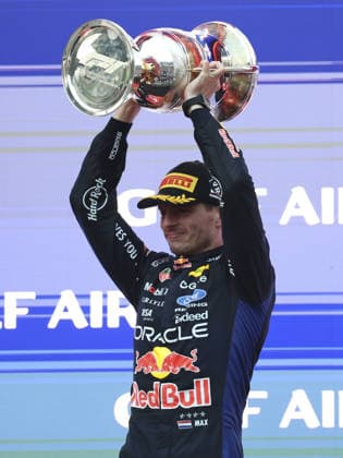 KUALA LUMPUR, MALAYSIA - OCTOBER 04: Max Verstappen of the Netherlands and Oracle Red Bull Racing celebrates on the podium with trophy after winning after the race of the FIA Formula 1 Grand Prix of Bahrain in Malaysia at the Sepang Circuit on October 04, 2026 in Kuala Lumpur, Malaysia. (Photo by Qian Jun SPP-Paddocker) Copyright: xQianxJun SPP-Paddockerx Sportspressphoto_SPR246577