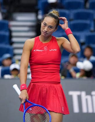 (261005) -- BEIJING, Oct. 5, 2026 -- Zheng Qinwen of China reacts during the women s singles round of 32 match against Marie Bouzkova of the Czech Republic at 2026 China Open tennis tournament in Beijing, China, Oct. 5, 2026. ) (SP)CHINA-BEIJING-TENNIS-CHINA OPEN-WOMEN S SINGLES(CN) SunxFei 