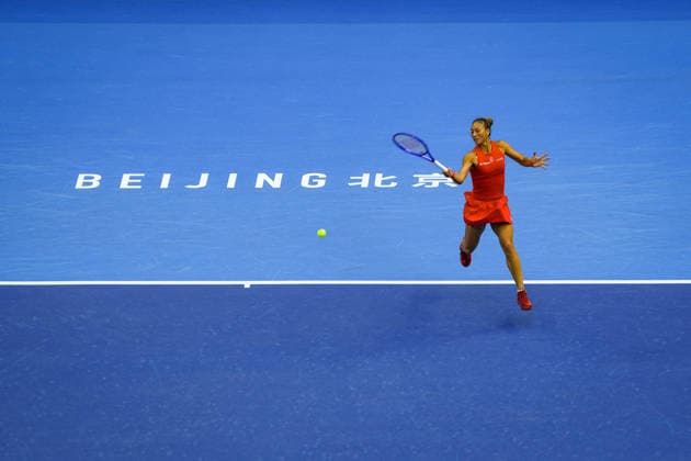 (261005) -- BEIJING, Oct. 5, 2026 -- Zheng Qinwen of China hits a return during the women s singles round of 32 match against Marie Bouzkova of the Czech Republic at 2026 China Open tennis tournament in Beijing, China, Oct. 5, 2026. ) (SP)CHINA-BEIJING-TENNIS-CHINA OPEN-WOMEN S SINGLES(CN) SunxFei 