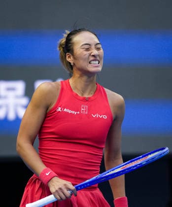 (261005) -- BEIJING, Oct. 5, 2026 -- Zheng Qinwen of China reacts during the women s singles round of 32 match against Marie Bouzkova of the Czech Republic at 2026 China Open tennis tournament in Beijing, China, Oct. 5, 2026. ) (SP)CHINA-BEIJING-TENNIS-CHINA OPEN-WOMEN S SINGLES(CN) SunxFei 