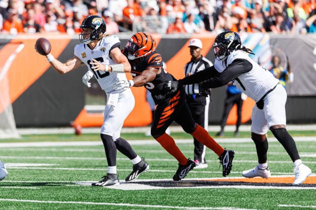Oct 4, 2026; Cincinnati, OH, USA; Jacksonville Jaguars quarterback Trevor Lawrence (16) passes the ball as he is pressured by Cincinnati Bengals defensive lineman Boye Mafe (53) during NFL, American Football Herren, USA game action at Paycor Stadium. Mandatory Credit: -Cal Media NFL 2026: Jaguars Vs Bengals OCT 04  - ZUMAc04_ 20261004_zma_c04_573 Copyright: xJohnxMersitsx