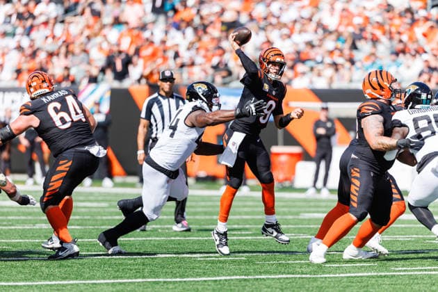 Oct 4, 2026; Cincinnati, OH, USA; Cincinnati Bengals quarterback Joe Burrow (9) passes the ball as he is pressured by Jacksonville Jaguars defensive lineman Travon Walker (44) during NFL, American Football Herren, USA game action at Paycor Stadium. Mandatory Credit: -Cal Media - ZUMAc04_ 20261004_zma_c04_583 Copyright: xJohnxMersitsx