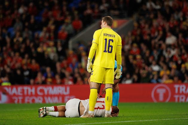 RECORD DATE NOT STATED 4th October 2026; Cardiff City Stadium, Cardiff, Wales; UEFA Nations League Football, Wales versus Denmark; Mads Hermansen of Denmark stands over Rasmus Kristensen of Denmark after collision with Wales player AmandaxMcMaster