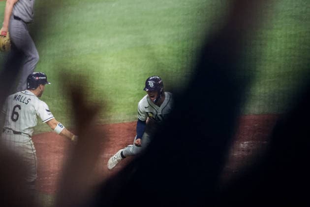 October 5, 2026, St. Petersburg, Florida, USA: Tampa Bay Rays right fielder JONNY DELUCA (21) reacts at home plate after scoring a run in game 2 of the American League Division Series against the New York Yankees. The Tampa Bay Rays hosted the New York Yankees the at Tropicana Field in St. Petersburg, FL. St. Petersburg USA - ZUMAm299 20261005_znp_m299_005 Copyright: xTaylorxMcFeex