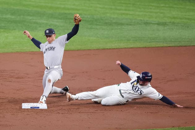 October 5, 2026, St. Petersburg, Florida, USA: New York Yankees shortstop GEORGE LOMBARD JR. (96) reaches towards second base for a double play during game 2 of the American League Division Series against the Tampa Bay Rays. The Tampa Bay Rays hosted the New York Yankees the at Tropicana Field in St. Petersburg, FL. MLB, Baseball Herren, USA 2026: Tampa Bay Rays 5:2 New York Yankees  - ZUMAm299 20261005_znp_m299_028 Copyright: xTaylorxMcFeex