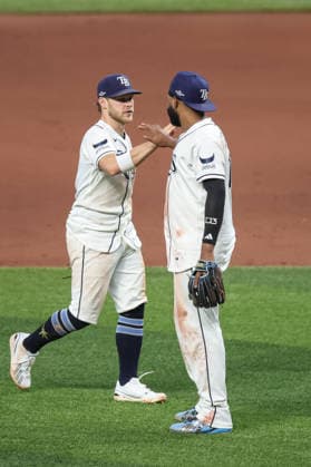 October 5, 2026, St. Petersburg, Florida, USA: Tampa Bay Rays shortstop TAYLOR WALLS (6) and third baseman JUNIOR CAMINERO (13) celebrate after a win against the New York Yankees in game 2 of the American League Division Series. The Tampa Bay Rays hosted the New York Yankees the at Tropicana Field in St. Petersburg, FL. MLB, Baseball Herren, USA 2026: Tampa Bay Rays 5:2 New York Yankees  - ZUMAm299 20261005_znp_m299_030 Copyright: xTaylorxMcFeex
