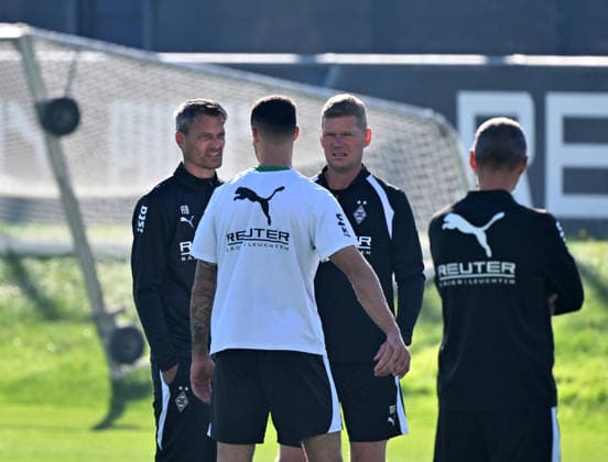 October 6, 2026, Mönchengladbach Soccer, Men s, 2026–2027 season, Borussia Mönchengladbach training session. In conversation (from left): Alexander Blessin, Gladbach coach; Tim Kleindienst, Gladbach; Markus Gellhaus, Gladbach assistant coach. DFL regulations prohibit any use of photographs as image sequences and or quasi-video footage at Borussia Park, North Rhine-Westphalia, Germany