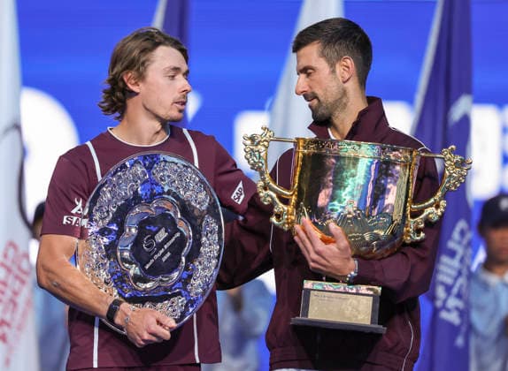 (261006) -- BEIJING, Oct. 6, 2026 -- Winner Novak Djokovic (R) of Serbia and runner-up Alex de Minaur of Australia communicate during the awarding ceremony for the men s singles final at 2026 China Open tennis tournament in Beijing, China, Oct. 6, 2026. ) (SP)CHINA-BEIJING-TENNIS-CHINA OPEN-MEN S SINGLES-AWARDING CEREMONY(CN) BaixXuefei 