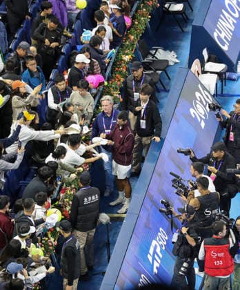 (261006) -- BEIJING, Oct. 6, 2026 -- Champion Novak Djokovic of Serbia sign autographs for supporters before the awarding ceremony for the men s singles final at 2026 China Open tennis tournament in Beijing, China, Oct. 6, 2026. (Photo by Xinhua) (SP)CHINA-BEIJING-TENNIS-CHINA OPEN-MEN S SINGLES-AWARDING CEREMONY(CN) MaxZihan 