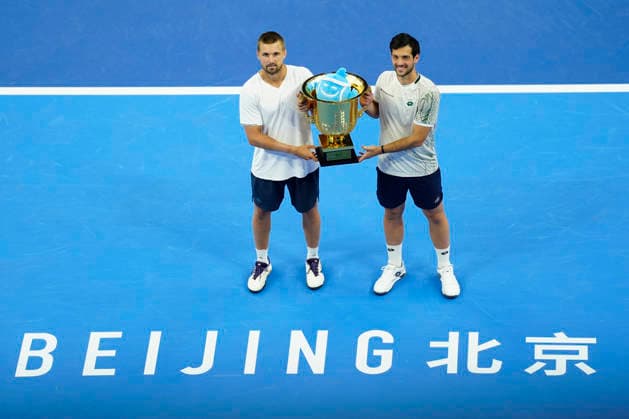 October 6, 2026, Beijing, China: Julian Cash and Lloyd Glasspool of Great Britain pose with their winner s trophy during the medal ceremony after winning against Sander Arends and David Pel of Netherlands (not in view) during the Men s Doubles final match on day seven of China Open at the National Tennis Center. Julian Cash and Lloyd Glasspool won, Final Score: 6-3, 3-6, 10-6 Beijing China - ZUMAs197 20261006_aaa_s197_258 Copyright: xPolyxFeix