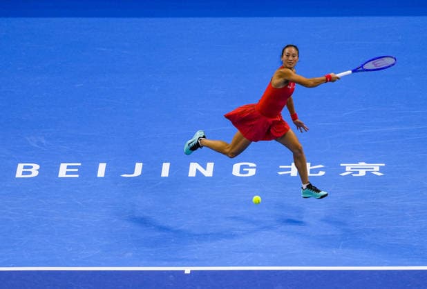 (261007) -- BEIJING, Oct. 7, 2026 -- Zheng Qinwen of China hits a return during the women s singles fourth round match between Zheng Qinwen of China and Alina Charaeva of Armenia at 2026 China Open tennis tournament in Beijing, China, Oct. 7, 2026. ) (SP)CHINA-BEIJING-TENNIS-CHINA OPEN-WOMEN S SINGLES (CN) SunxFei