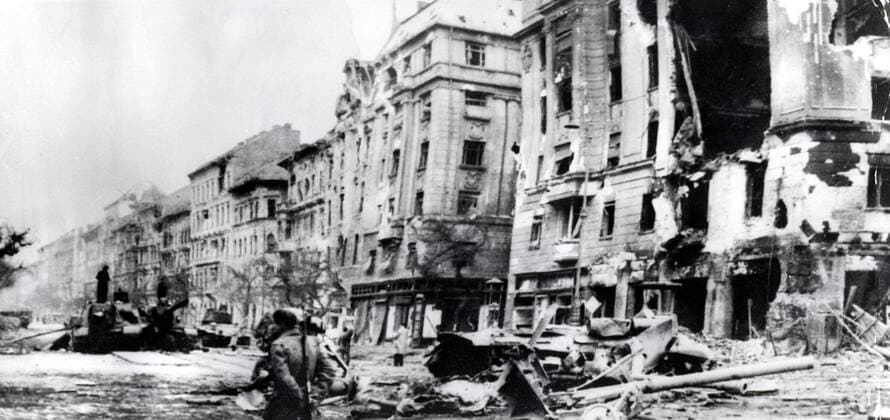 Oct 31, 1956 - Budapest, Hungary - The Hungarian Revolution of 1956 was a spontaneous nationwide revolt against the Stalinist government of Hungary and its Soviet-imposed policies, lasting from 23 October until 10 November 1956. It began as a student demonstration which attracted thousands as it marched through central Budapest to the Parliament building. After the revolt spread quickly across Hungary, and the government fell, thousands organized into militias, battling the State Security Police and Soviet troops. On 4 November, a large Soviet force invaded Budapest. By January 1957, the new Soviet-installed government had suppressed all public opposition. PICTURED: Panorama of Baross Street - ruins and destroyed soviet tanks. Budapest Hungary  - ZUMAk09