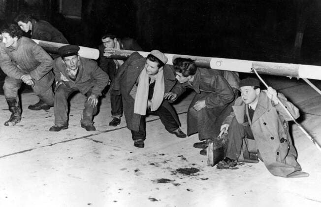 Nov 01, 1956 - Budapest, Hungary - The Hungarian Revolution of 1956 was a spontaneous nationwide revolt against the Stalinist government of Hungary and its Soviet-imposed policies, lasting from 23 October until 10 November 1956. It began as a student demonstration which attracted thousands as it marched through central Budapest to the Parliament building. After the revolt spread quickly across Hungary, and the government fell, thousands organized into militias, battling the State Security Police and Soviet troops. On 4 November, a large Soviet force invaded Budapest. By January 1957, the new Soviet-installed government had suppressed all public opposition. PICTURED: Hungarian refugees fleeing into Austria. Budapest Hungary  - ZUMAk09