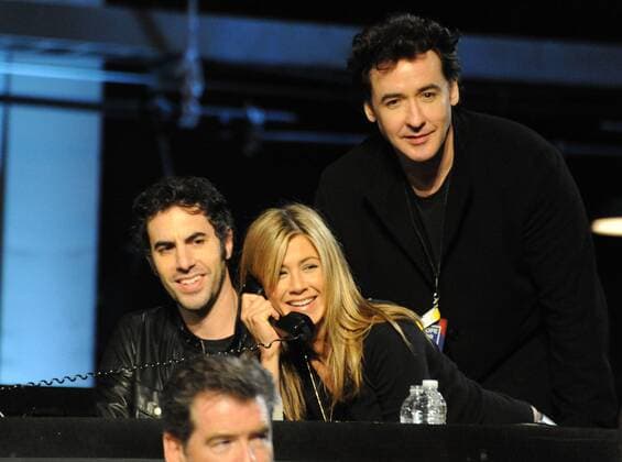 In this handout photo provided by MTV, actors Sacha Baron Cohen, Jennifer Aniston and John Cusack (L-R) gather at the Hope For Haiti Now: A Global Benefit For Earthquake Relief telethon on January 22, 2010 in Los Angeles.  LAP2010012235