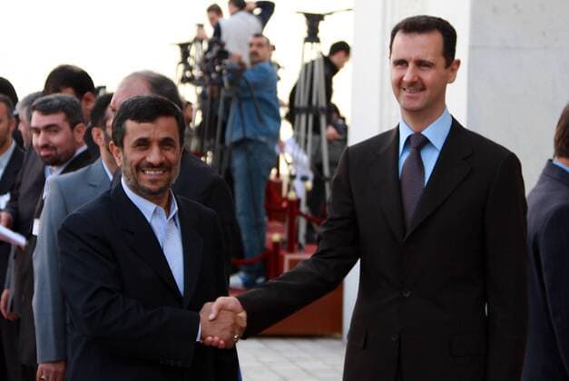(100225) -- DAMASCUS, Feb. 25, 2010 (Xinhua) -- Syrian President Bashar al-Assad (R) greets his Iranian counterpart Mahmoud Ahmadinejad at the Al-Shaab presidential palace in Damascus on Feb. 25, 2010. Iran s President Mahmoud Ahmadinejad started his two-day visit to Damascus on Thursday. (Xinhua Bassim) (yy) (2)SYRIA-IRAN-VISIT 