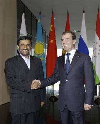 ITAR-TASS 13: YEKATERINBURG, RUSSIA. JUNE 16, 2009. President of Russia Dmitry Medvedev and President of Iran Mahmoud Ahmadinejad (L) appear prior to a narrow format summit meeting of the Shanghai Cooperation Organization (SCO) member states and SCO observer states.  Highlight 1002122