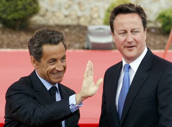(110526) -- DEAUVILLE, May 26, 2011 (Xinhua) -- France s President Nicolas Sarkozy (L) waves as he welcomes Britain s Prime Minister David Cameron at the G8 summit in Deauville, northern France May 26, 2011. (Xinhua Reuters POOL Yves Herman)(cl) FRANCE-DEAUVILLE-G8 SUMMIT 