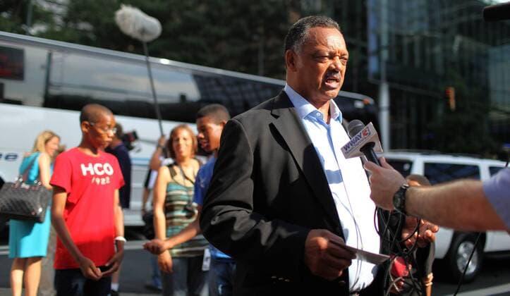Rev. Jesse Jackson (C) is interviewed on video by a newsman near the Carolinafest during the 2012 Democratic National Convention in Charlotte, North Carolina on September 3, 2012.  DNC2012090329