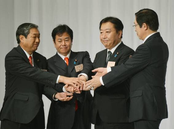 September 21, 2012, Tokyo, Japan - Japanese Prime Minister Yoshihiko Noda, second from right, shakes hands with candidates for the leadership of the ruling Democratic Party of Japan following his reelection in Tokyo on Friday, September 21,2012. They are, from left: former Agriculture Minister Hirotaka Akamatsu; former griculture Minister Michihiko Kano; former Internal Affairs Minister Kazuhiro Haraguchi; Noda and former Agriculture Minister Michihiko Kano. Noda, 55, retained the leadership with the backing of many lawmakers and rank-and-file party members,. He is ready to reshuffle his party executives and Cabinet. (Photo by Natsuki Sakai AFLO)  ayfa008098
