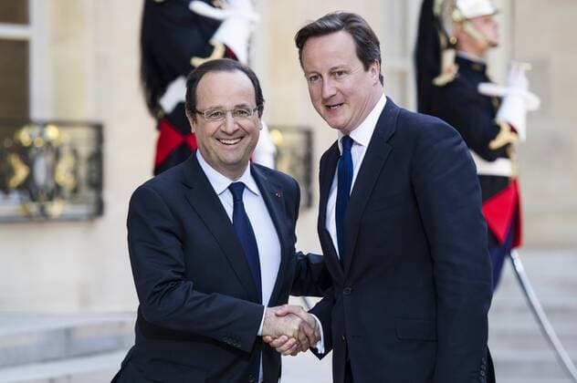 PARIS -- French President Francois Hollande (L) meets with British Prime Minister David Cameron at the Elysee Palace in Paris, France, May 22, 2013. French President Francois Hollande and British Prime Minister David Cameron on Wednesday condemned the assassination of a British soldier in the suburbs of London after their meeting in Paris. (Xinhua Etienne Laurent) (zw) FRANCE-BRITAIN-HOLLANDE-CAMERON 