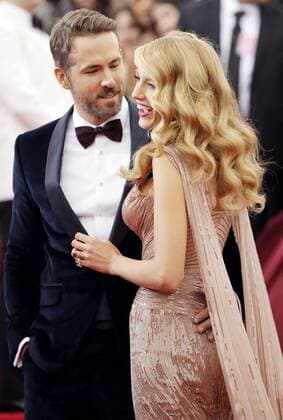 Blake Lively and Ryan Reynolds arrive on the red carpet at the Costume Institute Benefit celebrating the opening of Charles James: Beyond Fashion and the new Anna Wintour Costume Center at the Metropolitan Museum of Art in New York City on May 5, 2014.  NYP20140505148