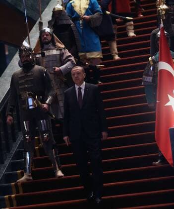 Turkish President Recep Tayyip Erdogan in front of 16 soldiers who represent the 16 Turkish states founded in the past at the presidential palace in Ankara, Turkey on January 12, 2015