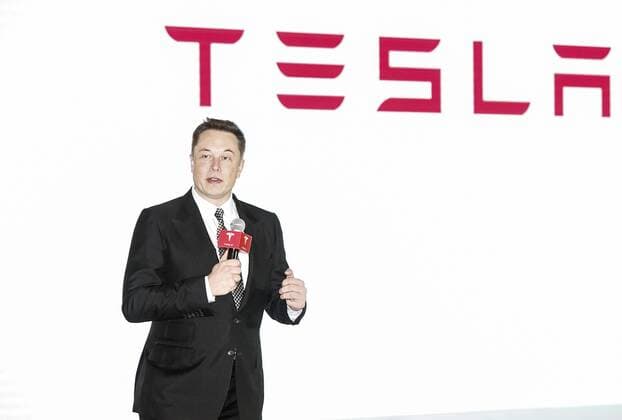 BEIJING, CHINA - OCTOBER 23: (CHINA OUT) Elon Musk, Chairman, CEO and Product Architect of Tesla Motors, addresses a press conference to declare that the Tesla Motors releases v7.0 System in China on a limited basis for its Model S, which will enable self-driving features such as Autosteer for a select group of beta testers on October 23, 2015 in Beijing, China. The v7.0 system includes Autosteer, a new Autopilot feature. While it s not absolutely self-driving and the driver still need to hold the steering wheel and be mindful of road conditions and surrounding traffic when using Autosteer. When set to the new Autosteer mode, graphics on the driver s display will show the path the Model S is following, post the current speed limit and indicate if a car is in front of the Tesla. CFP474763519