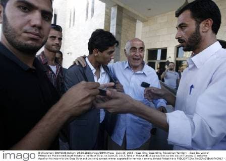 June 25, 2013 - Gaza City, Gaza Strip, Palestinian Territory - Arab Idol winner Palestinian Mohammed Assaf arrives to the Gaza Strip, on June 25, 2013. Tens of thousands of joyous fans turned out on Tuesday to welcome Assaf on his return to the Gaza Strip and the song contest winner appealed for harmony among divided Palestinians  - ZUMAews