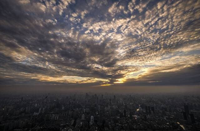 September 9, 2016 - Los Angeles, California, U.S - Storm clouds move over the Shanghai skyline viewed from the Shanghai Tower in Shanghai, China. Shanghai is the most populous city in China and the most populous city proper in the world. It is one of the four direct-controlled municipalities of China, with a population of more than 24 million as of 2014. It is a global financial centre, and a transport hub with the world s busiest container port. Located in the Yangtze River Delta in East China, Shanghai sits on the south edge of the mouth of the Yangtze in the middle portion of the Chinese coast. The municipality borders the provinces of Jiangsu and Zhejiang to the north, south and west, and is bounded to the east by the East China Sea. A major administrative, shipping, and trading town, Shanghai grew in importance in the 19th century due to trade and recognition of its favourable port - ZUMAc68_