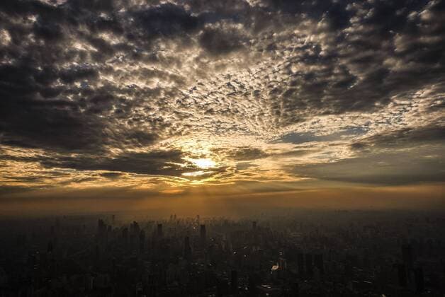 September 9, 2016 - Los Angeles, California, U.S - Storm clouds move over the Shanghai skyline viewed from the Shanghai Tower in Shanghai, China. Shanghai is the most populous city in China and the most populous city proper in the world. It is one of the four direct-controlled municipalities of China, with a population of more than 24 million as of 2014. It is a global financial centre, and a transport hub with the world s busiest container port. Located in the Yangtze River Delta in East China, Shanghai sits on the south edge of the mouth of the Yangtze in the middle portion of the Chinese coast. The municipality borders the provinces of Jiangsu and Zhejiang to the north, south and west, and is bounded to the east by the East China Sea. A major administrative, shipping, and trading town, Shanghai grew in importance in the 19th century due to trade and recognition of its favourable port - ZUMAc68_