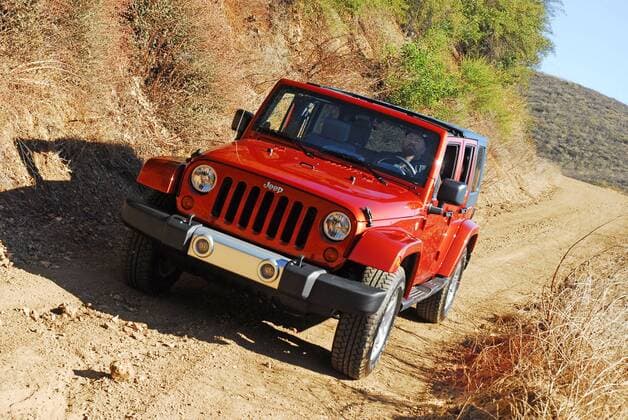 Nov 10, 2008 - Los Angeles, California, USA - The 2009 Jeep Wrangler Unlimited remains the only four-door convertible on the market. With room for five adults, it features the most cargo space ever offered in a Wrangler, plus class-leading off-road capability and everyday practicality. PHOTO: Headon Action High Angle - ZUMAs06_ 20081110_mkh_s06_717