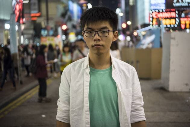 Hong Kong: Joshua Wong at the Booth Hong Kong political party Demosisto set up booth on the street in Causeway Bay, Hong Kong. Its secretary general Joshua Wong was calling people to participate in the campaign hold next week which is about the disqualification issue of the lawmakers.  ChanxLongxHei