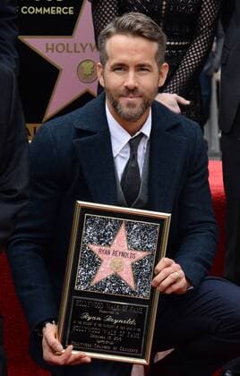 Actor Ryan Reynolds holds a replica plaque during an unveiling ceremony honoring him with the 2,596th star on the Hollywood Walk of fame in Los Angeles on December 15, 2016.  LAP2016121517 JIMxRUYMEN