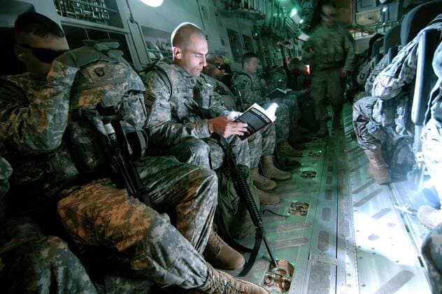 Mar 21, 2008 - Manas Air Base, Kyrgyzstan - Captain JACOB BAILEY of Clyde, Texas, spends the flight time from Kyrgyzstan to Afghanistan reading Steve Coll s ,Ghost War, about the CIA s history in the central Asia. Captain Bailey is part of the 101st Airborne Division Headquarters that is deploying to Afghanistan to assume from the 82nd Airborne Division command of the US s eastern regional command for Operation Enduring Freedom. - ZUMAav2_ 20080321_jac_av2_210