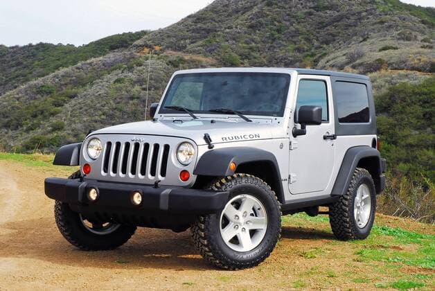 Mar 20, 2007 - Los Angeles, CA, USA - The 2007 Jeep Wrangler Rubicon Two-Door. The new Jeep Wrangler Unlimited takes on a radical four-door open-air design with JeepÕs signature design cues-classic round headlamps, seven-slot grille, trapezoidal wheels flares, exposed forged hinges combined with Wrangler UnlimitedÕs longer wheelbase, front-hinged B-pillar and larger sport bar-creating a stance that commands attention.  - ZUMA 20070320_cob_s06_809