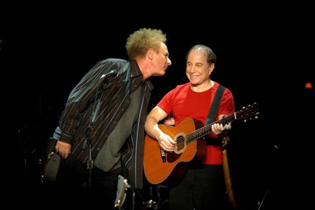 Paul Simon (red shirt) and Art Garfunkel (tall) share a brief moment of conversation following a standing ovation at the opening of Thursday nights concert, November 20, 2003 at Arco Arena in Sacramento, California. Sacramento Bee photograph by November 20, 2003 ZUMA Press  - ZUMAGARF 20030922_aai_s76_885 Copyright: xJosexLuisxVillegasx
