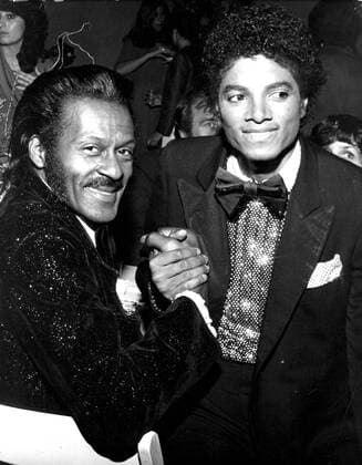 CHUCK BERRY (October 18, 1926 - March 18, 2017) was an American guitarist, singer and songwriter and is one of the pioneers of rock and roll music. With iconic songs such as Maybellene (1955), Roll Over Beethoven (1956), Rock and Roll Music (1957) and Johnny B. Goode (1958), Berry refined and developed rhythm and blues into the major elements that made rock and roll distinctive, with lyrics focusing on teen life and consumerism and music featuring guitar solos and showmanship that were a major influence on subsequent rock music. PICTURED: CHUCK BERRY and MICHAEL JACKSON circa 1980.  - ZUMA 20050114_mda_g49_158 Copyright: xGlobexPhotosx
