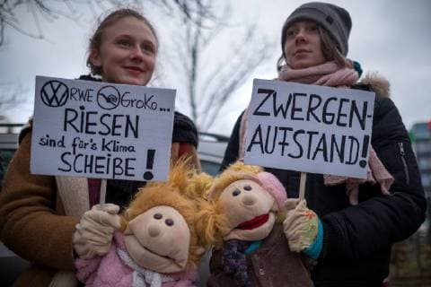 Climate change protest Berlin several hundred people demonstrate in Berlin for a phase-out of coal power to the end of the coalition talks between the CDU CSU and SPD forming the activists symbolically a red line to the Willy Brandt Haus Berlin Berlin Germany