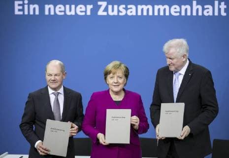 The designated Federal Finance Minister Olaf Scholz SPD Chancellor Angela Merkel CDU and the designated Federal Interior Minister Horst Seehofer CSU pose as part of the signing of the coalition agreement between the SPD CDU and CSU at the Paul Loebe House in Berlin 12 03 2018 Berlin Germany Copyright: xFlorianxGaertner photothek.netx