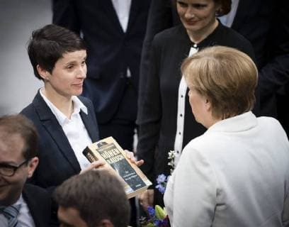 Frauke Petry L AfD gives Chancellor Angela Merkel CDU a book entitled Hoehenrausch in the context of the swearing-in of the new Federal Government in Berlin 14 03 2018 Berlin Germany Copyright: xXanderxHeinl photothek.netx