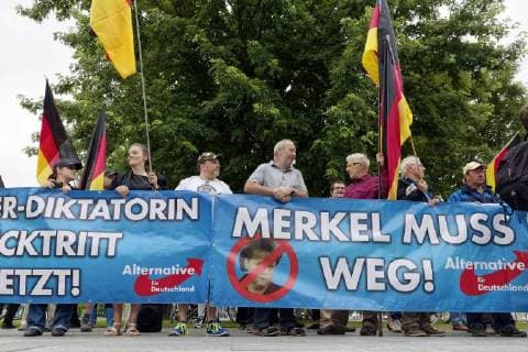 AfD demonstrators in front of the Chancellors office 2018 06 13 Berlin Germany On the evening after the integration summit in the Chancellery, a group of AFD supporters in front of the Chancellery calls for the resignation of the Chancellor, whom she calls the chancellors dictator