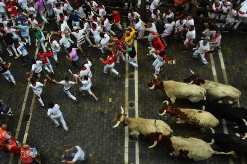 Participants run ahead of Puerto de San Lorenzo s fighting bulls on the first day of the San Fermin bull run festival in Pamplona Spain on July 7 2018 First run of the San Fermin fiestas with bulls of the Port of San Lorenzo on July 7, 2018 Oscar Zubiri Cordon Press  OscarxZubiri