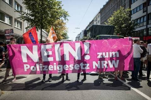Demonstration No to the new police law NRW on 07 July 2018 in Dusseldorf The protesters go because of the planned tightening of the police law in NRW on the street demonstration no to the new police law NRW in Duesseldorf