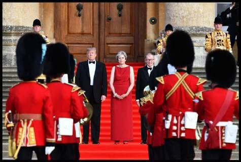 . 12 07 2018. London, United Kingdom. President Trumps visit to Britain. (L-R on the steps) US President Donald Trump, Britain s Prime Minister Theresa May and her husband Philip May stand on steps in the Great Court as the bands of the Scots, Irish and Welsh Guards perform a ceremonial welcome as they arrive for a black-tie dinner with business leaders at Blenheim Palace, west of London, on July 12, 2018, on the first day of President Trump s visit to the UK. The four-day trip, which will include talks with Prime Minister Theresa May, tea with Queen Elizabeth II and a private weekend in Scotland, is set to be greeted by a leftist-organised mass protest in London on Friday xi-Imagesx xPoolx IIM-18198-0012