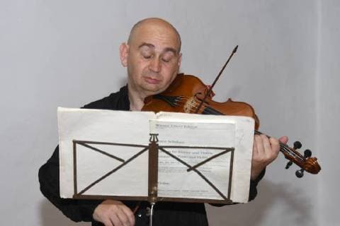 Violinist Ilja Korol practices in the Klostersaal Traunkirchen for his performance in the evening in front of an audience of Salzkammergut Festwochen Gmunden This picture shows the well-known international Russian violin specialist on the background of ancient music Ilja Korol For his musical achievements he was awarded Austrian citizenship