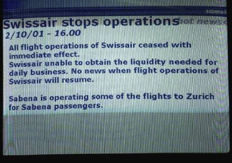 BRU81 - - BRUSSELS, BELGIUM: A monitor at Brussels national airport announces all Swissair planes have to stay on the ground, Tuesday, October 02, 2001. The crisis Swiss airline Swissair is going through, is getting bigger every day: this Tuesday, the planes remained on the ground, since no kerosene was available. Swissair also decided yesterday not to pay the promised 124 million Euro to Belgian airlines company Sabena. HERWIG VERGULT JACQUESxCOLLET  x733209x