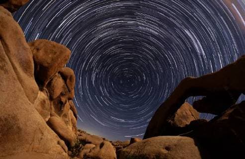 September 2, 2018 - Los Angeles, California, U.S - Star trails are seen above the Arch Rock at Joshua Tree National Park in Twentynine Palms, California, September 1, 2018 Los Angeles U.S. - ZUMAc68_ 20180902_zaf_c68_001 Copyright: xRingoxChiux