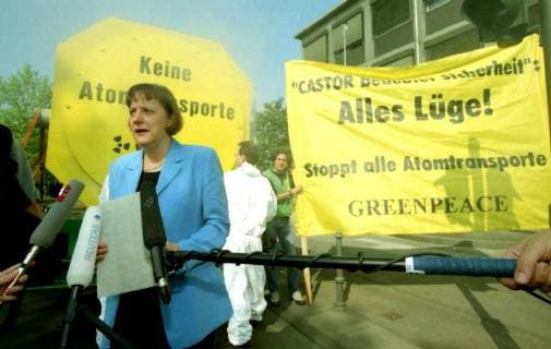 German Environment Minister Angela Merkel inspects a Greenpeace demonstration in front of the Bonn Ministry Wednesday May 20 1998 Federal Environment Minister Angela Merkel visited a Green